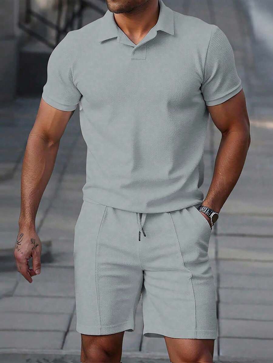 Men's textured polo shirt and shorts set in light grey with relaxed silhouette and matching shorts