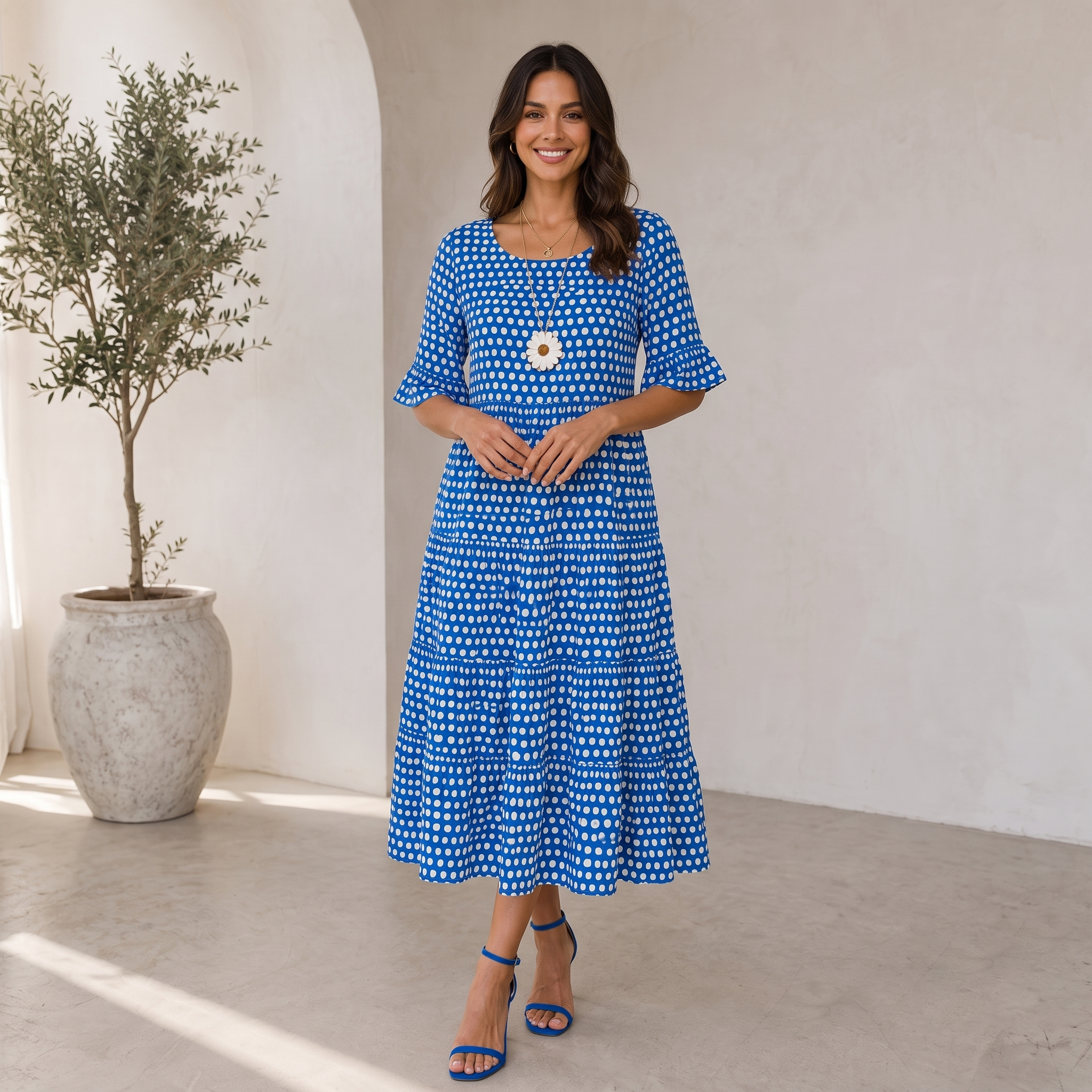 Women's midi-length polka dot dress with gathered ruffle skirt and loose silhouette