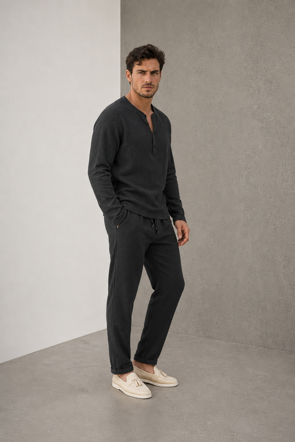 Men's black two-piece textured lounge set with long-sleeved Henley shirt and trousers