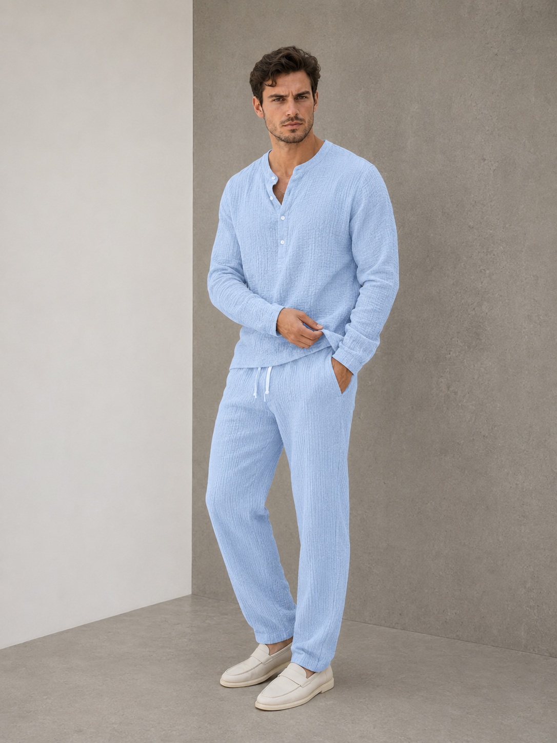 Men's light blue two-piece textured lounge set with long-sleeved Henley shirt and trousers