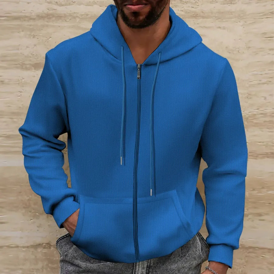 Men's zip-up hoodie worn casually — relaxed fit side profile
