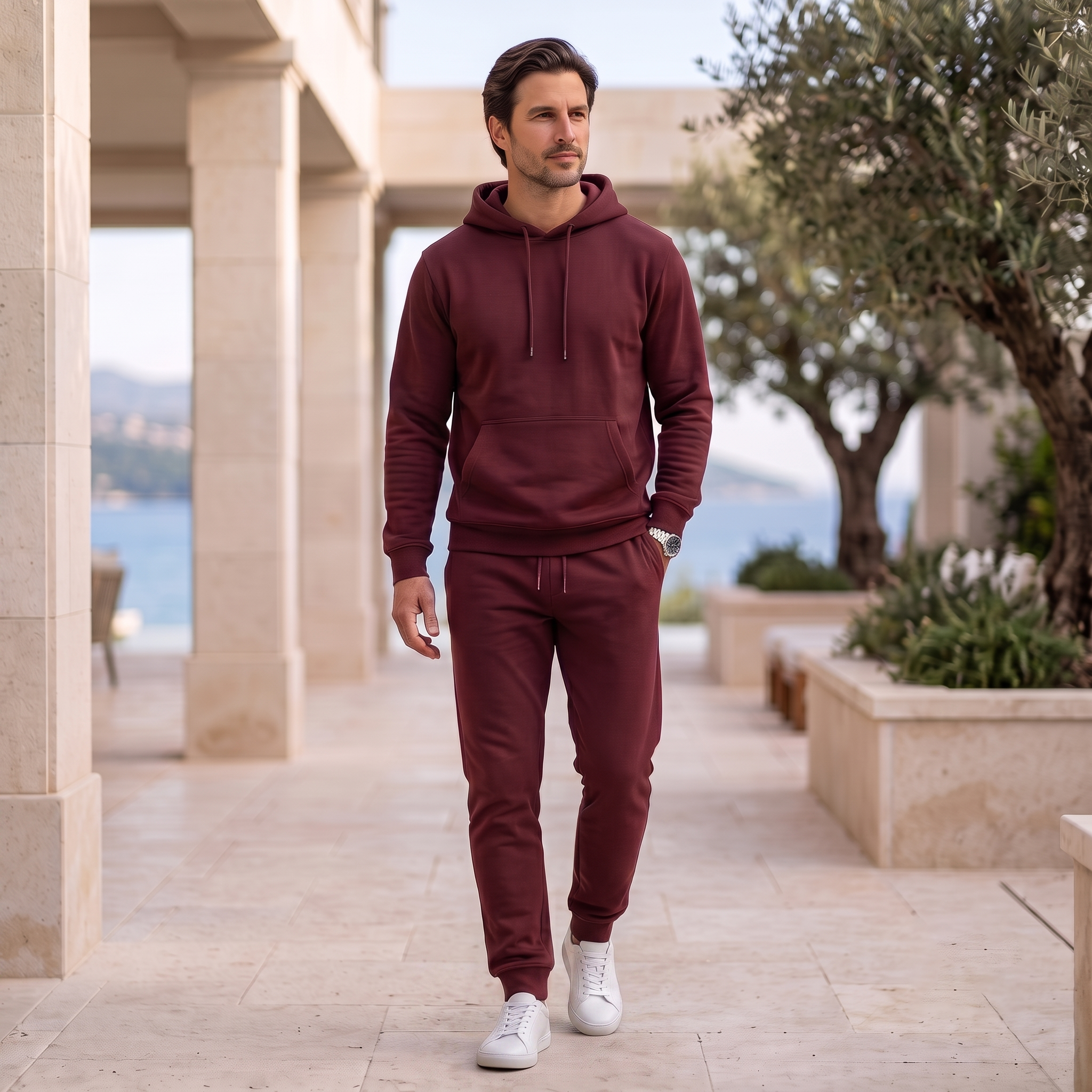Men's hoodie and joggers set with drawstring hood, kangaroo pocket, ribbed cuffs, and tapered joggers with elastic waistband