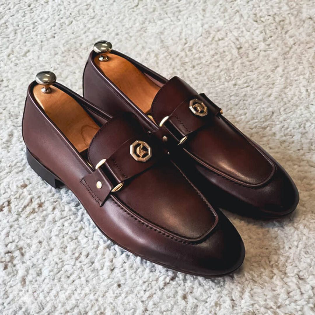 Men's leather loafers with metal strap detail and stitched construction