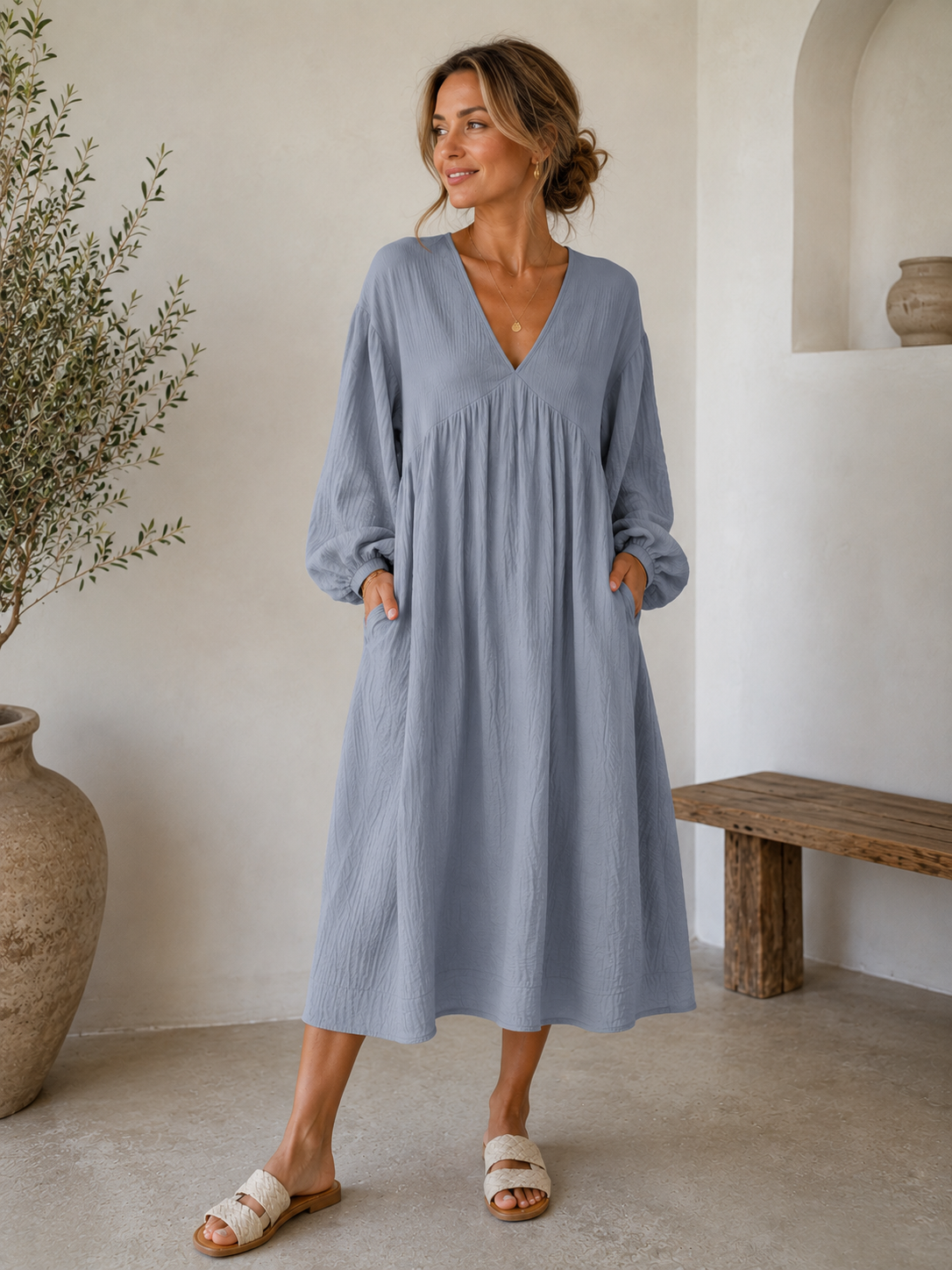 Women's loose midi dress with V-neckline, gathered front detail, long sleeves with elastic cuffs, and a straight hem