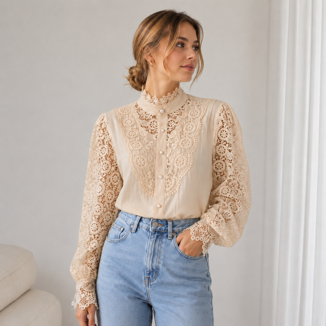 Close-up of lace fabric texture on a women's long-sleeve blouse with high collar