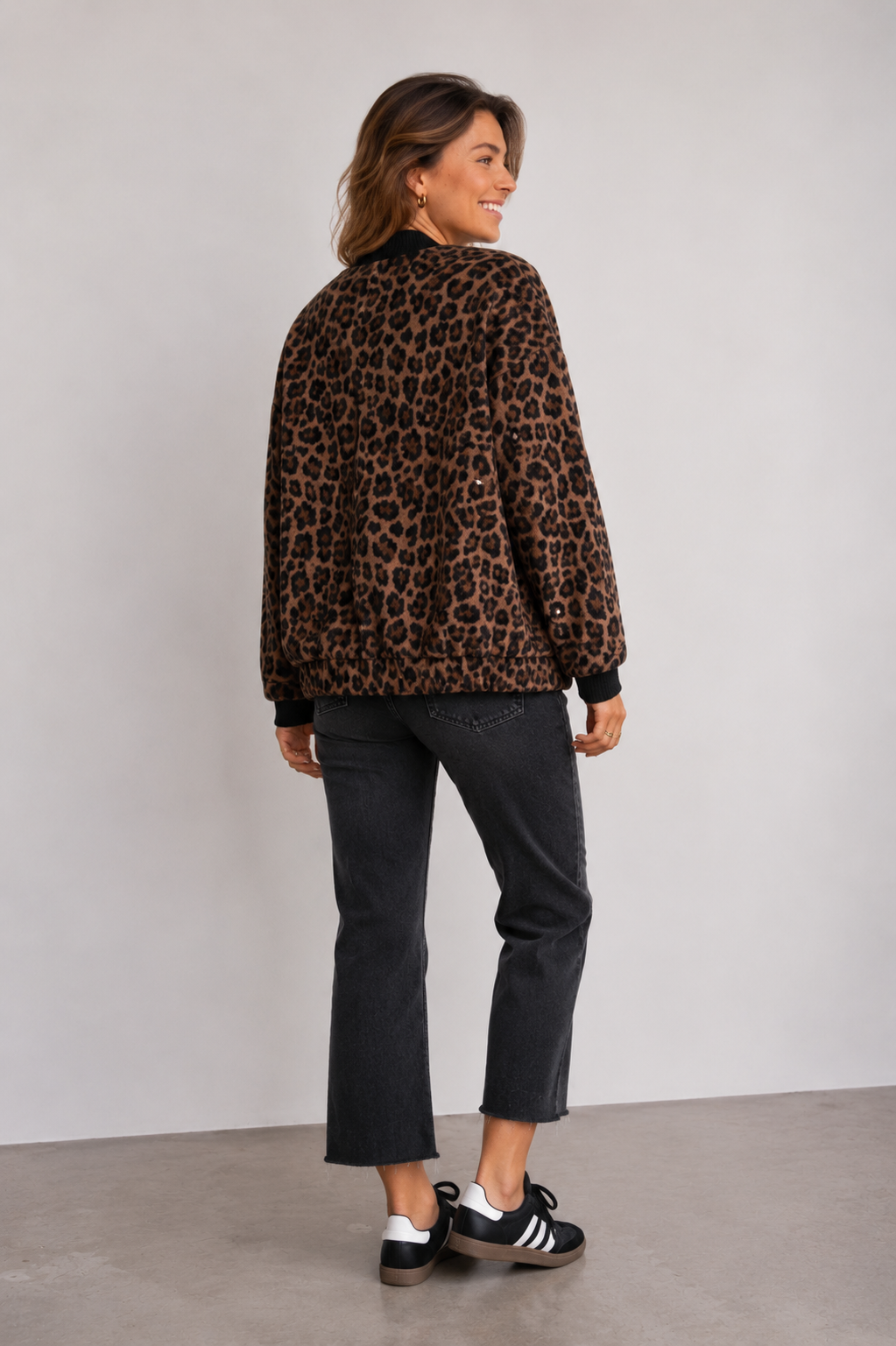 Women's leopard print jacket full-length front view showing snap button closure