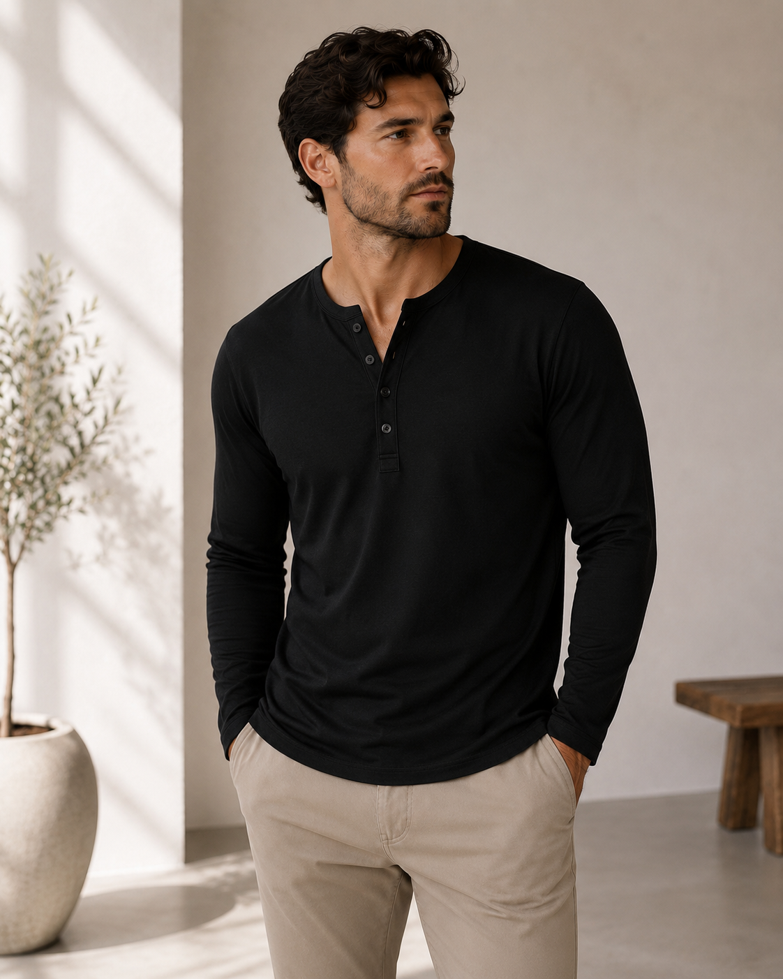 Close-up of Henley button placket and round neckline on men's long-sleeved shirt