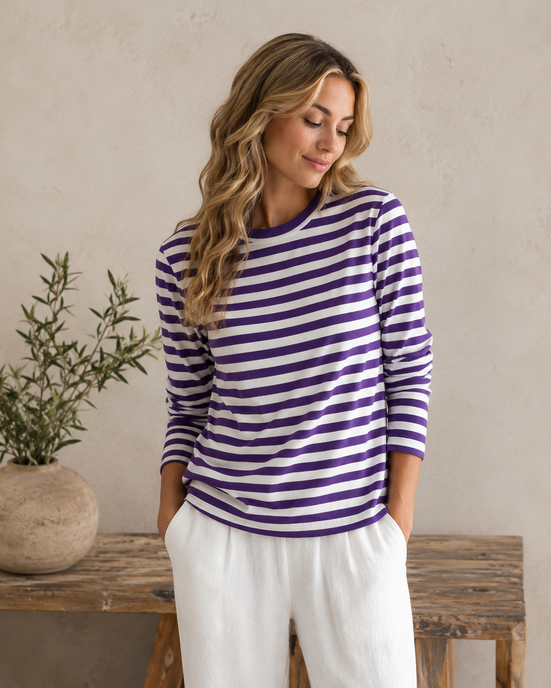 Women's striped knit top with long sleeves and a round neckline