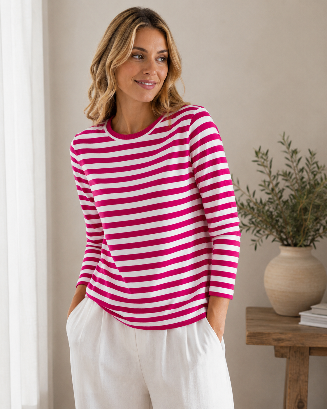 Long-sleeved women's knit top with horizontal stripe pattern