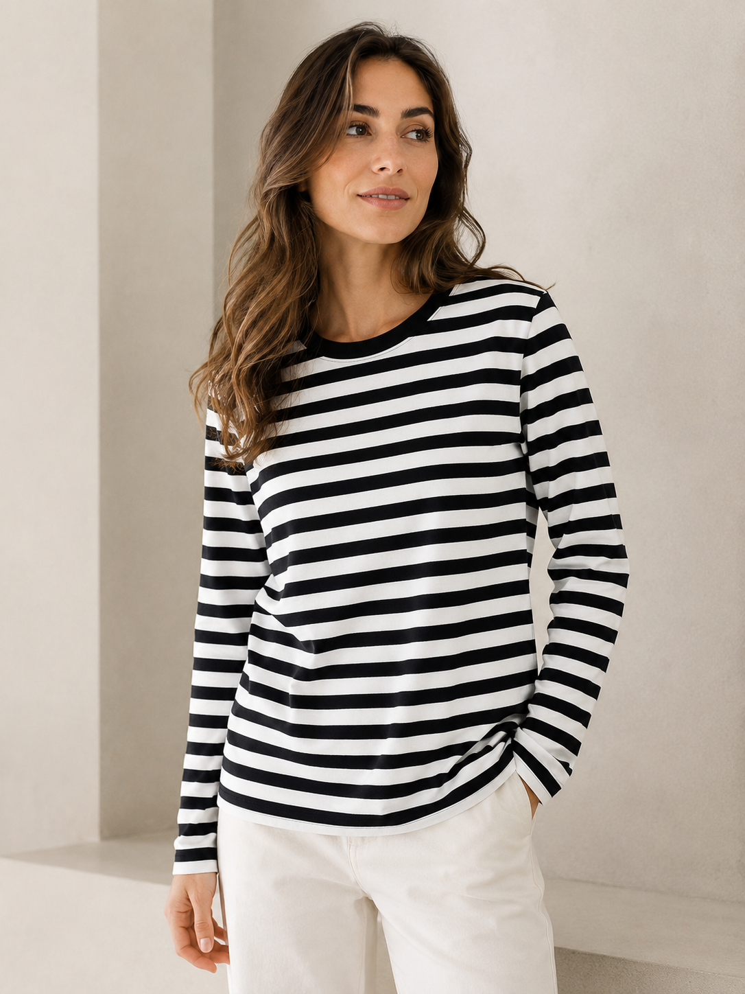 Women's knit top with horizontal stripes, long sleeves, and a straight hem