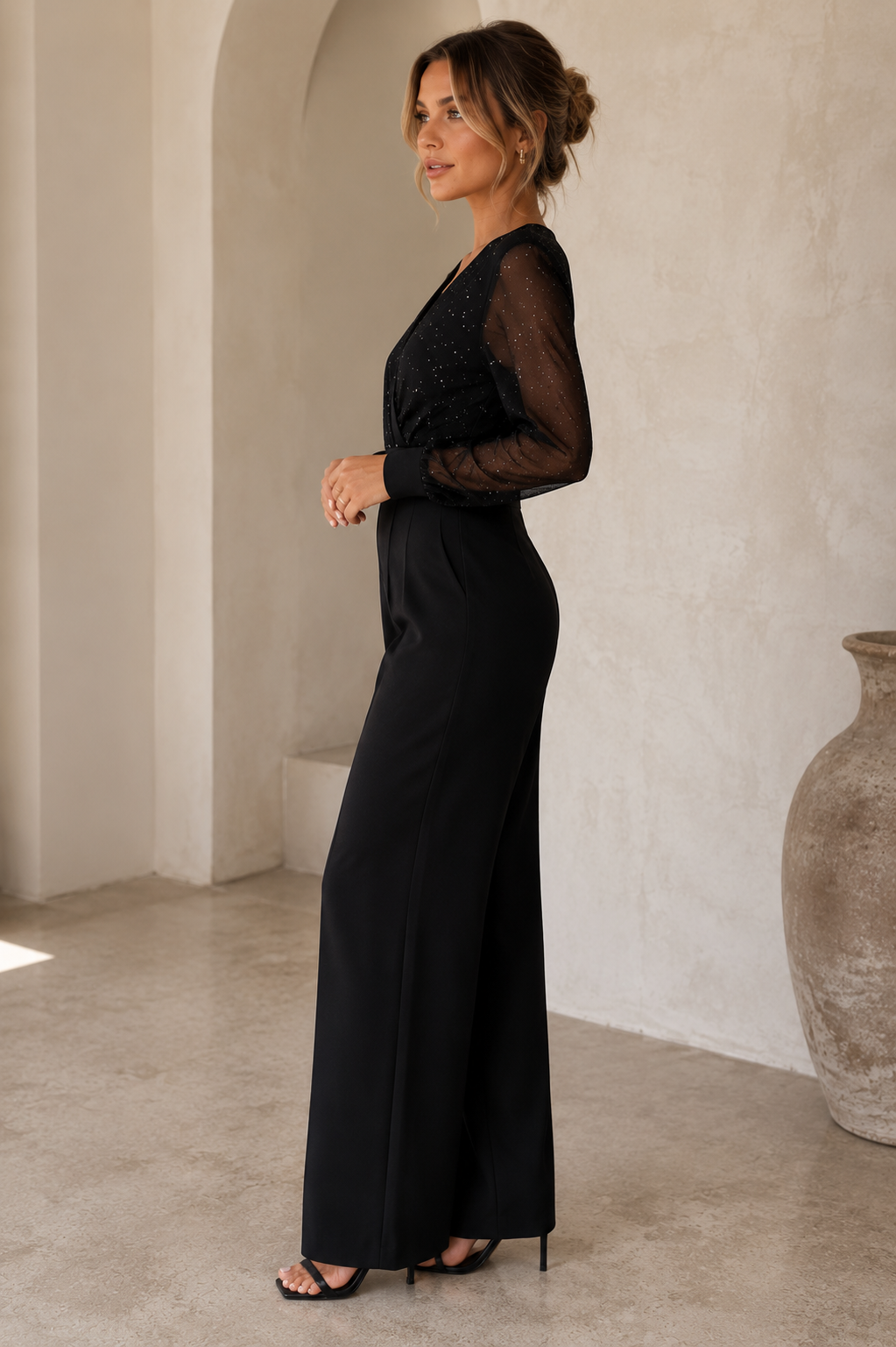 Women's woven jumpsuit with sheer mesh long sleeves and wide-leg silhouette