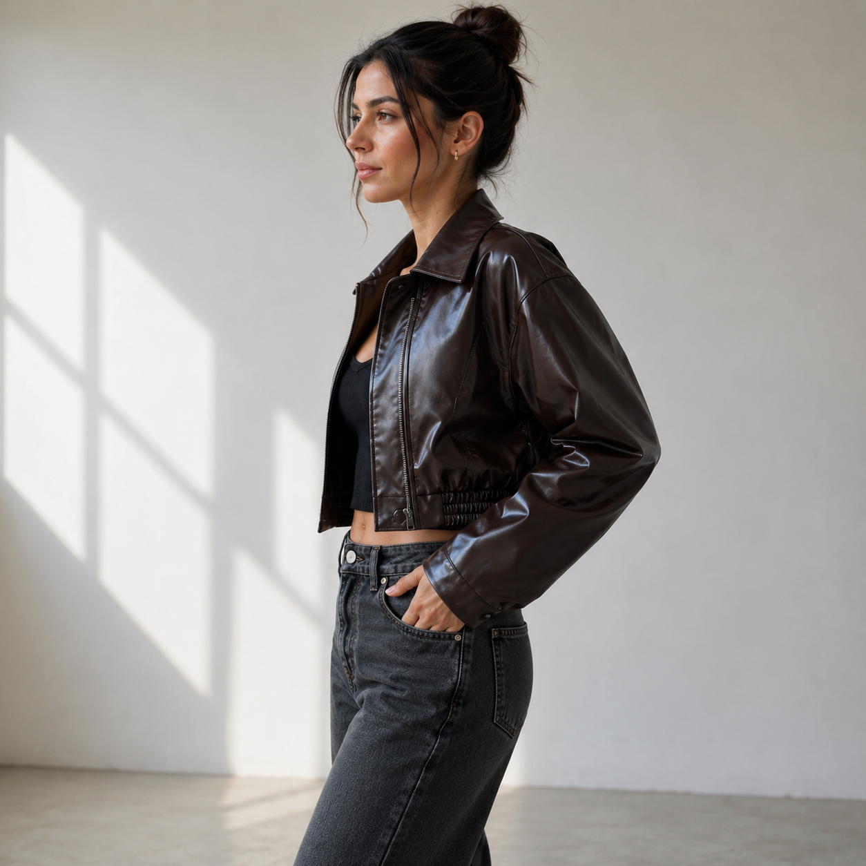 Women's short faux leather jacket with button closure and classic collar