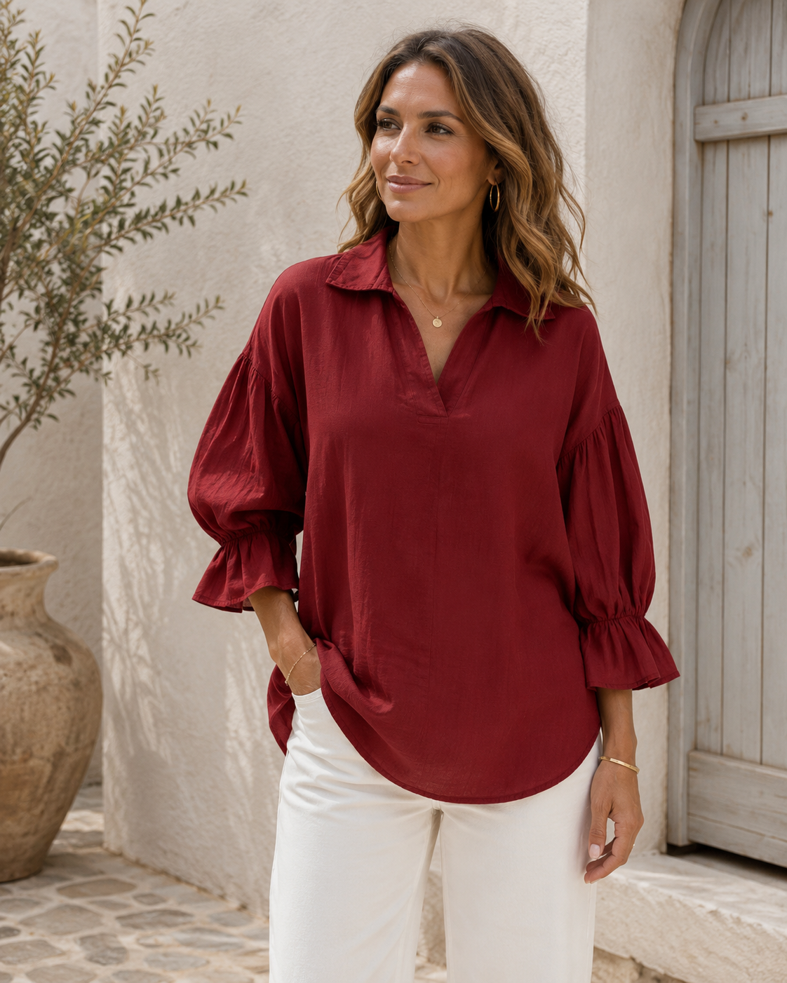 Elegant women's blouse with V-neckline and flowing puff sleeves