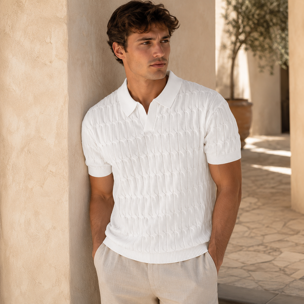 Front view of men's textured open collar knit polo shirt