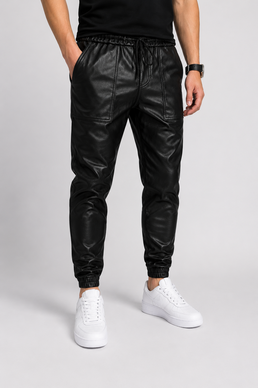 Men's faux leather joggers with elastic drawstring waistband and tapered leg