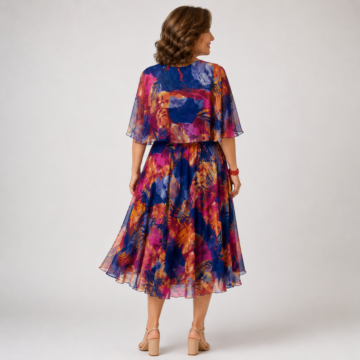 Chiffon dress with round neckline, short ruffled sleeves, and adjustable waist tie