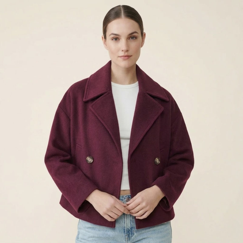 Women's short double-breasted wool blend coat with wide lapels and structured silhouette