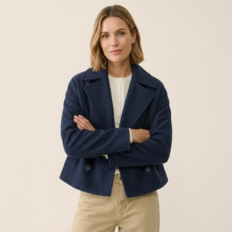 Women's short double-breasted wool coat with long sleeves and structured panel construction