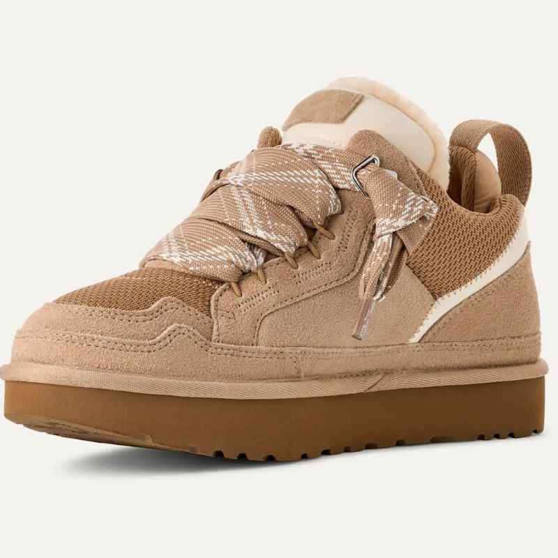 Low-top women's sneakers with reinforced lace-up eyelets, padded collar, and structured panel upper