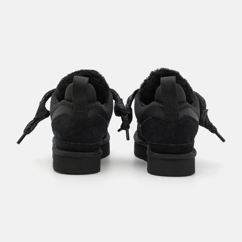 Women's lace-up low-top sneakers with layered panel upper, padded collar, and thick patterned rubber sole