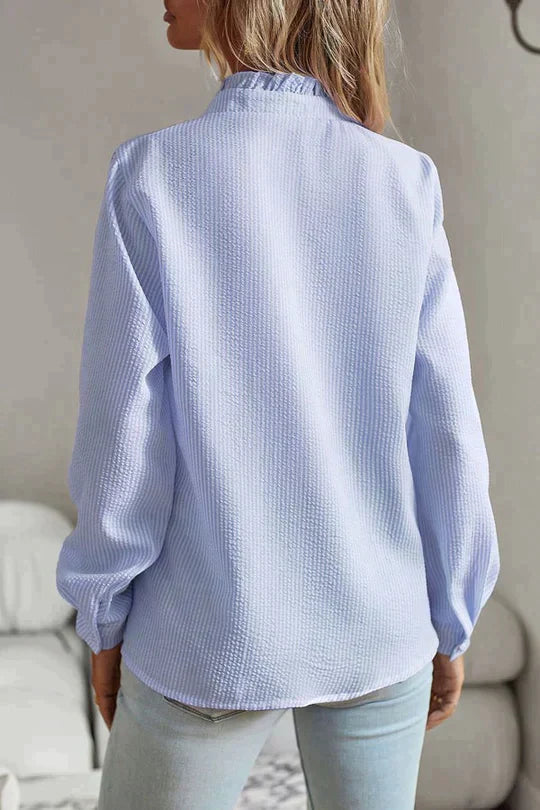 Women's lightweight textured blouse with ruffled neckline and front trim