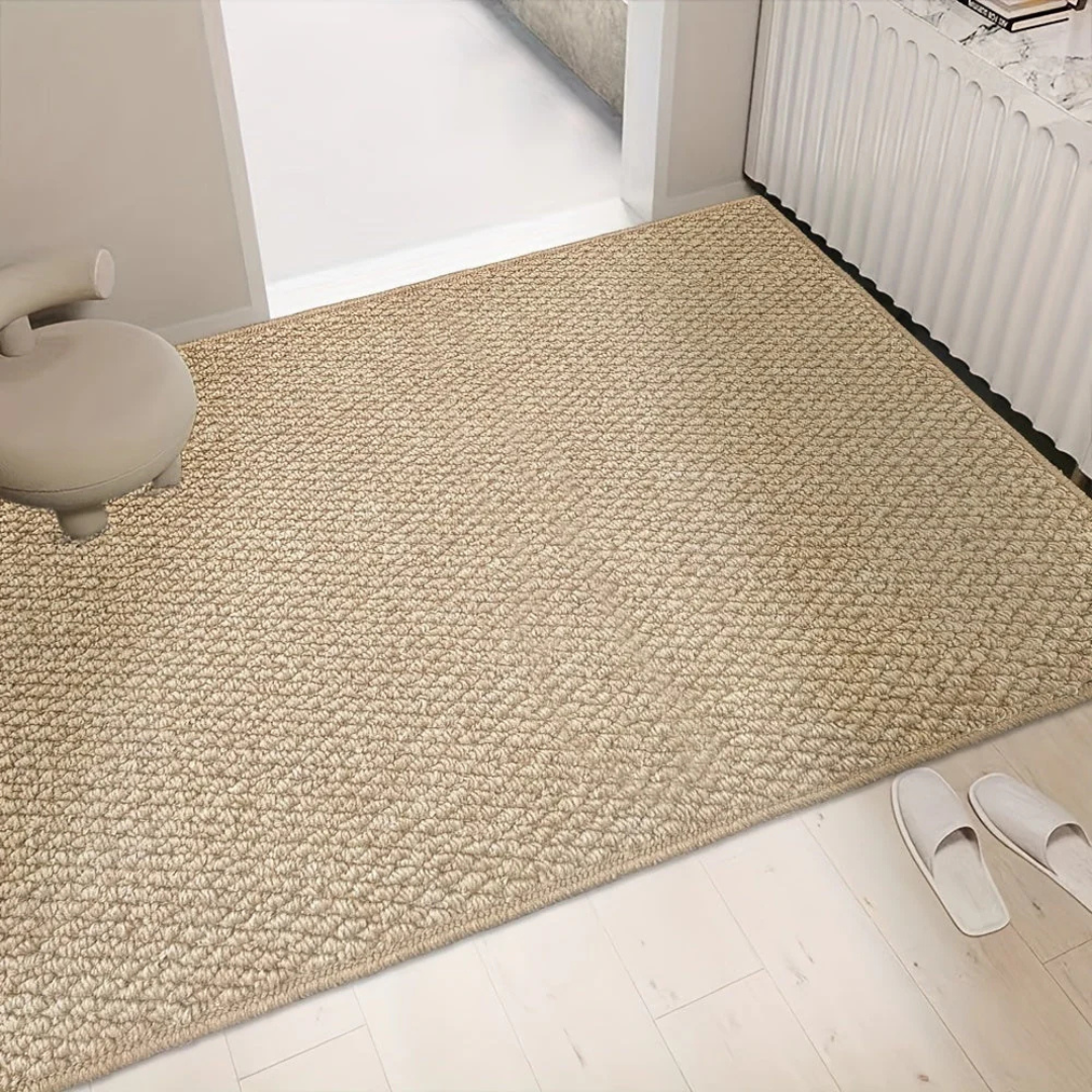 Flat-woven entrance mat with finished edges and even texture suitable for hallway placement