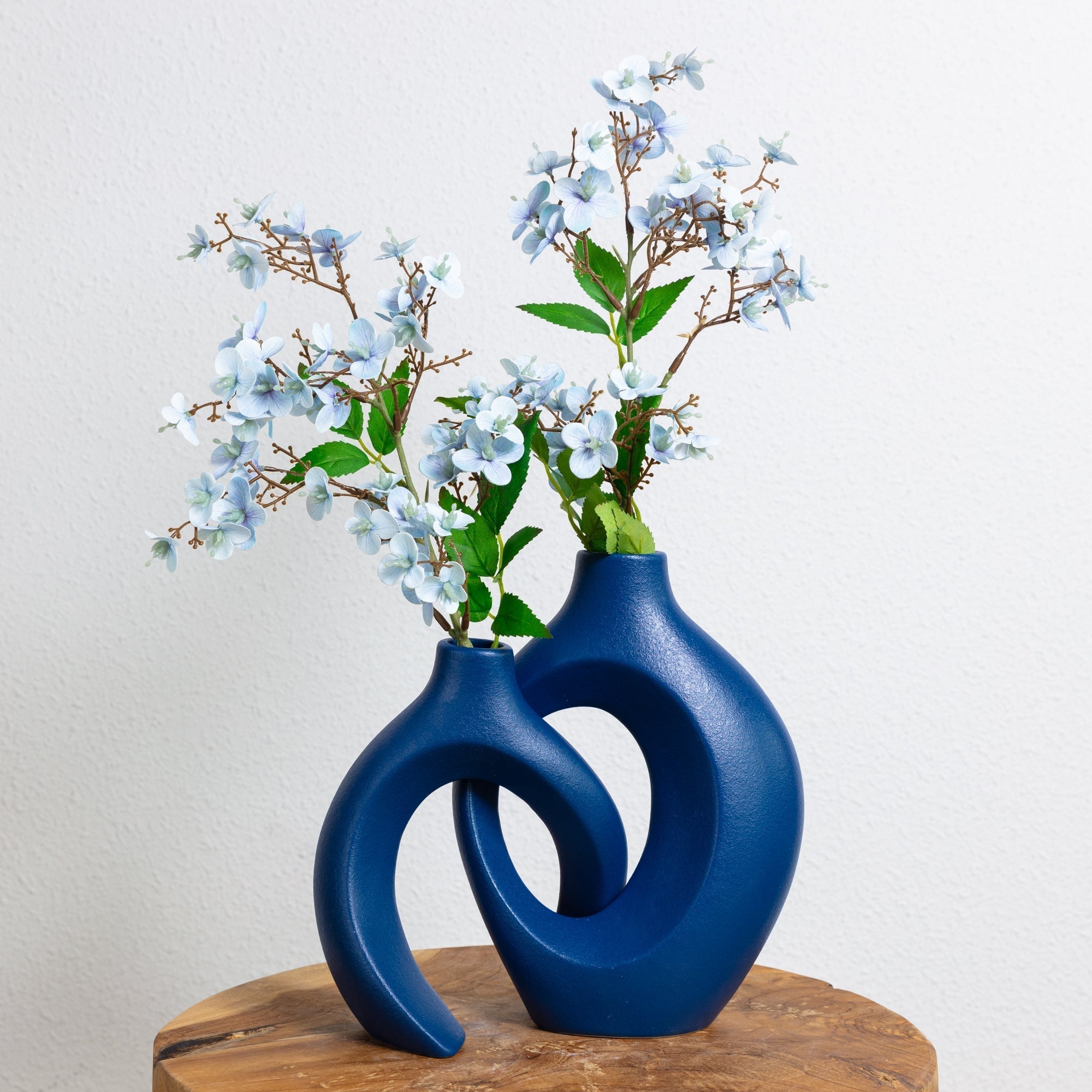 Artistic ceramic vase set with intertwined silhouette and matte glaze