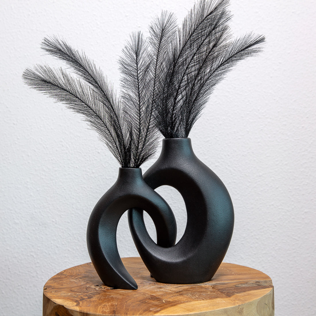 Pair of sculptural ceramic vases used as living room décor