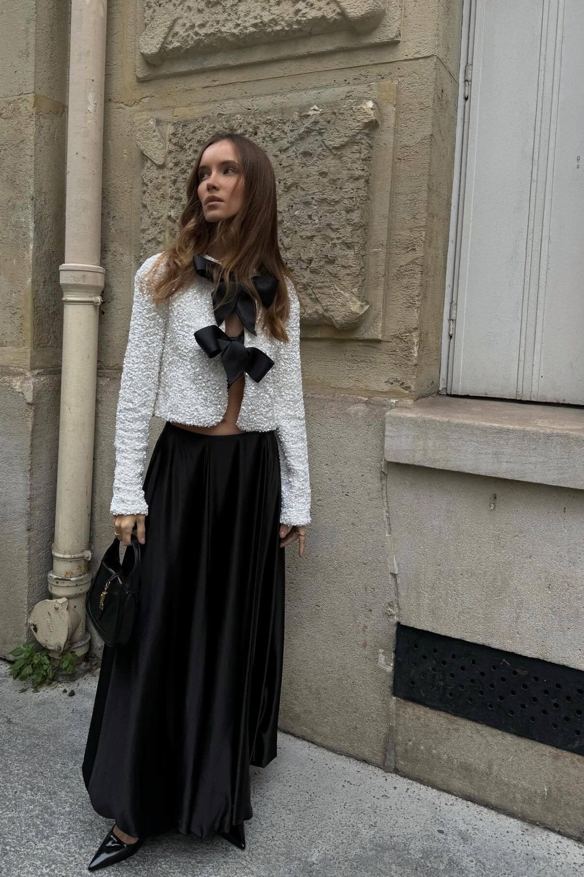 Structured women's short jacket with bow details, back view