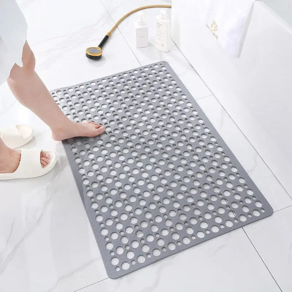 Perforated rubber shower mat with drainage holes for indoor bathroom use