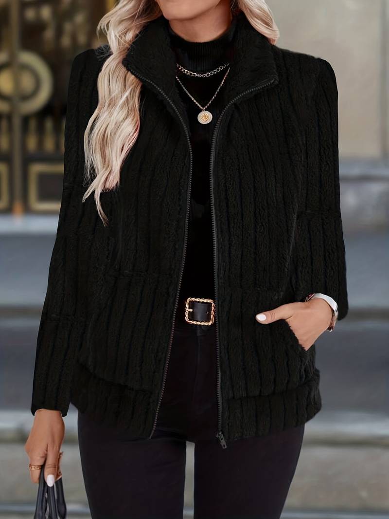 Women's zip-up jacket with high stand-up collar, textured polyester blend fabric, and hip-length silhouette