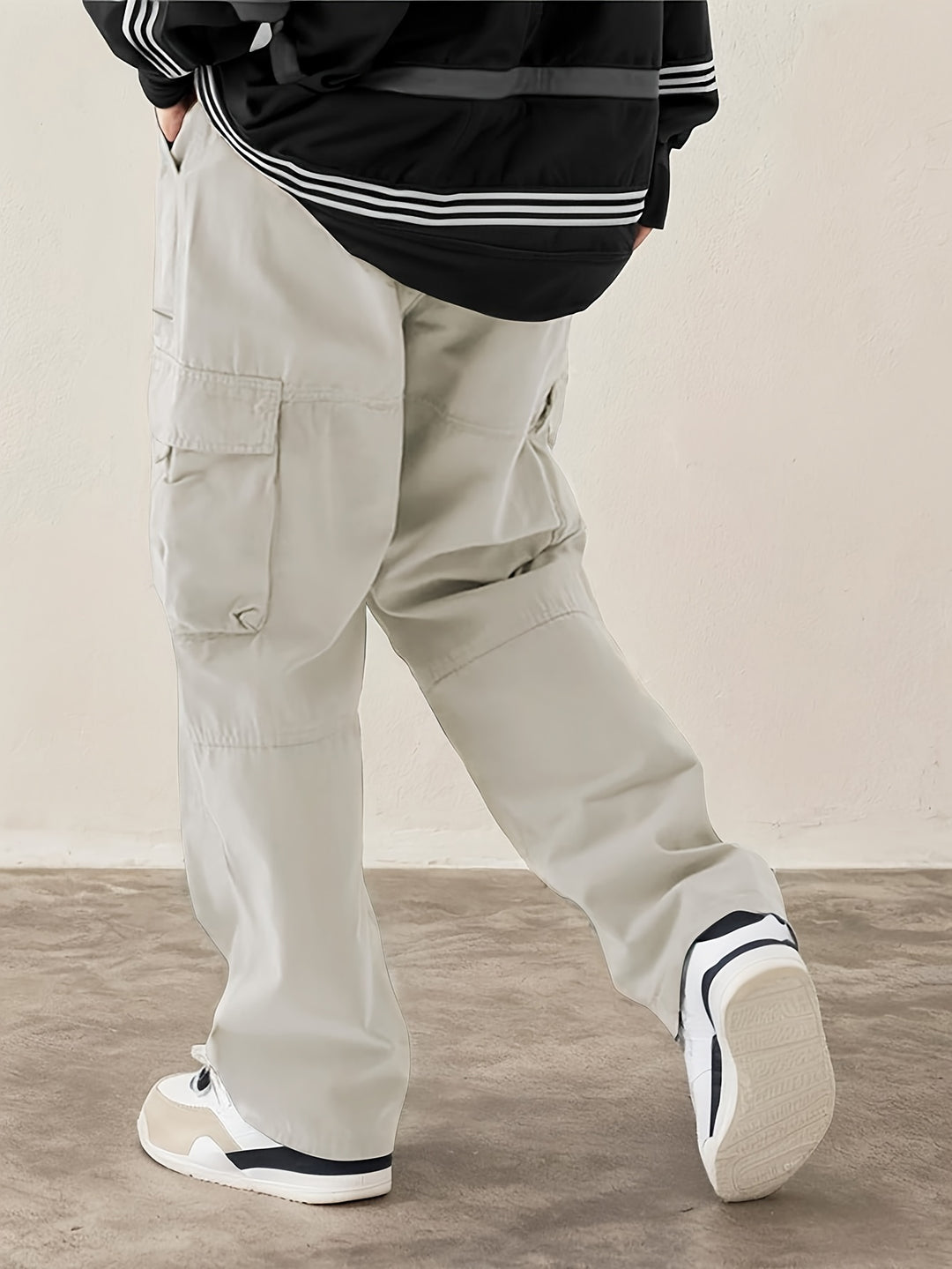 Men's woven cargo trousers with drawstring waist and flap pocket detailing in cotton-blend fabric