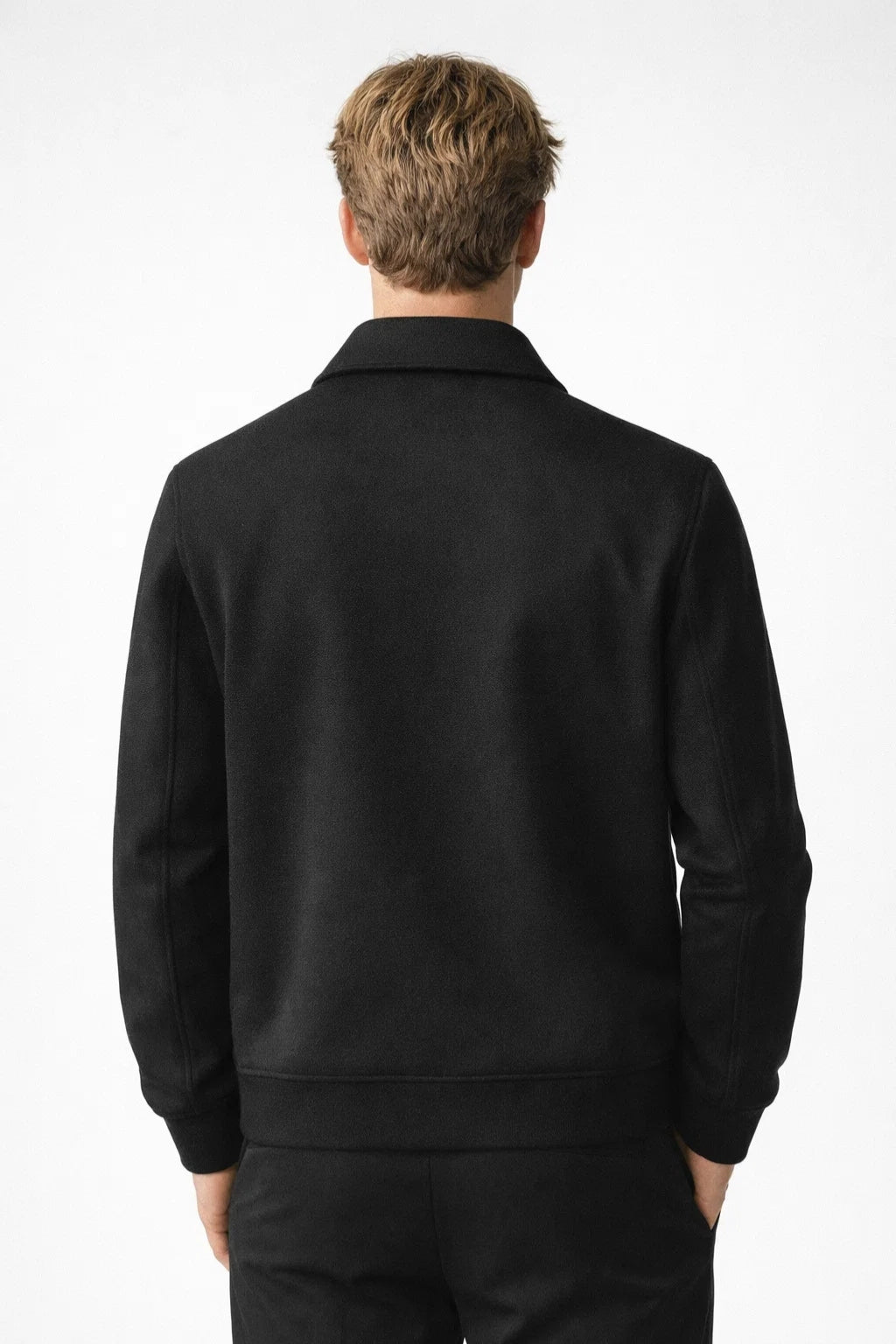 Men's woven jacket with long sleeves, clean seams, and structured silhouette