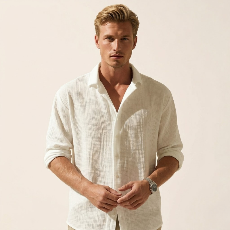 Men's long-sleeved button-up shirt with textured woven fabric, open collar, and front button closure