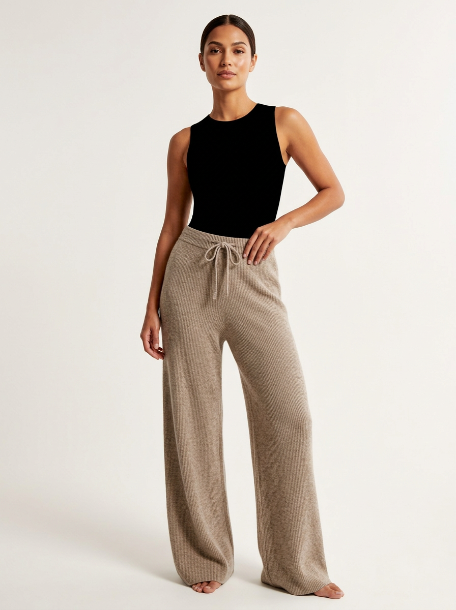 Stickade byxor med vid siluett och elastisk midja för dam