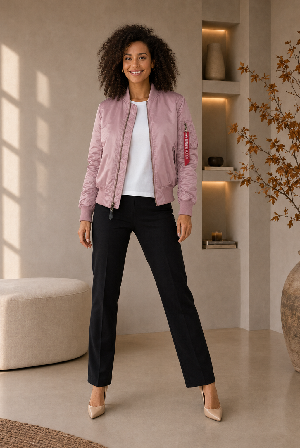 Women's bomber jacket with long sleeves, ribbed cuffs, and zippered sleeve pocket