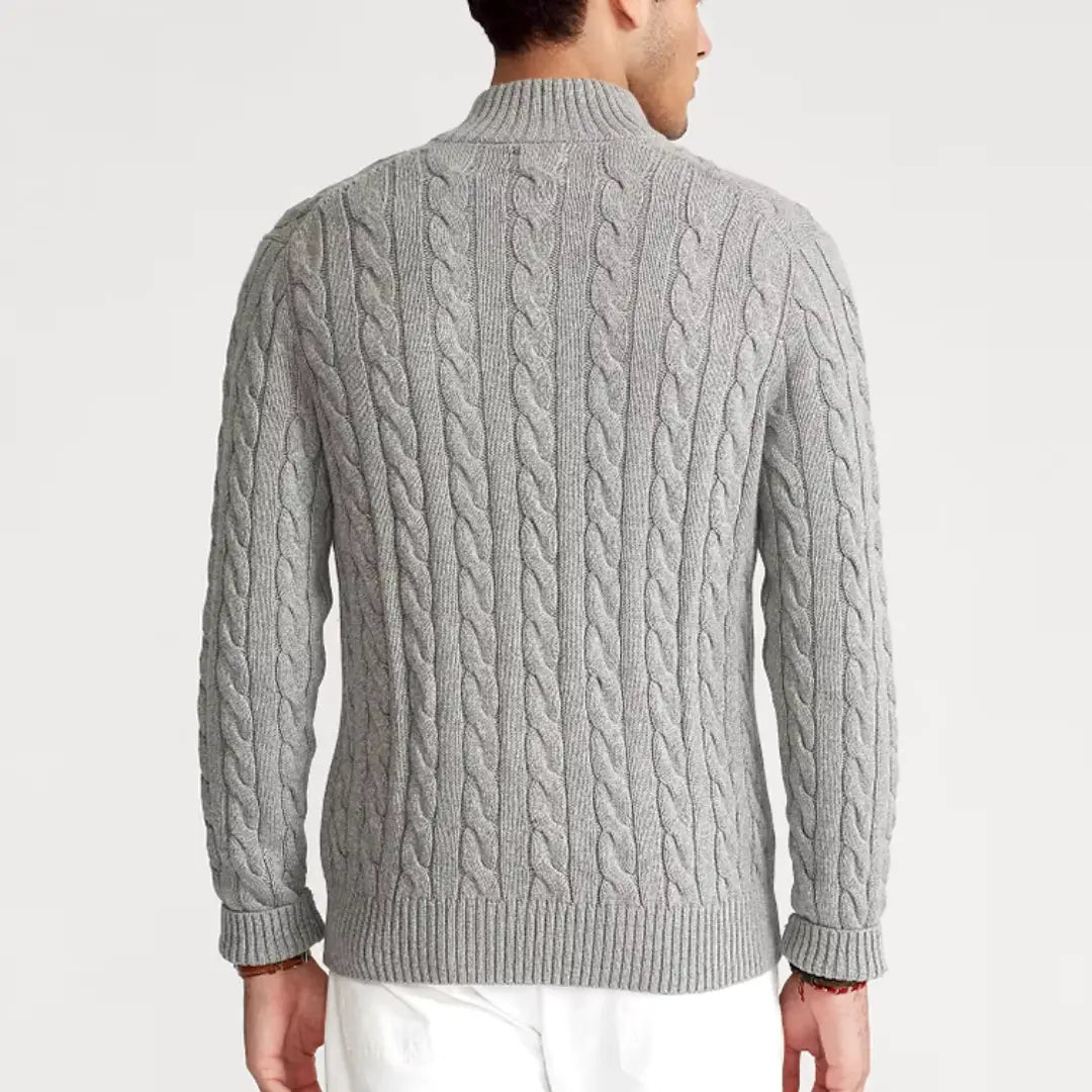 Men's cable-knit sweater with quarter-zip neckline, worn as a standalone top