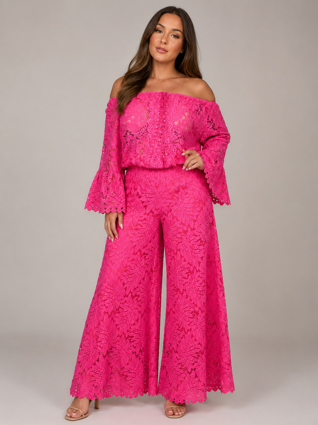 Women's fuchsia off-shoulder lace jumpsuit with long sleeves and flared legs