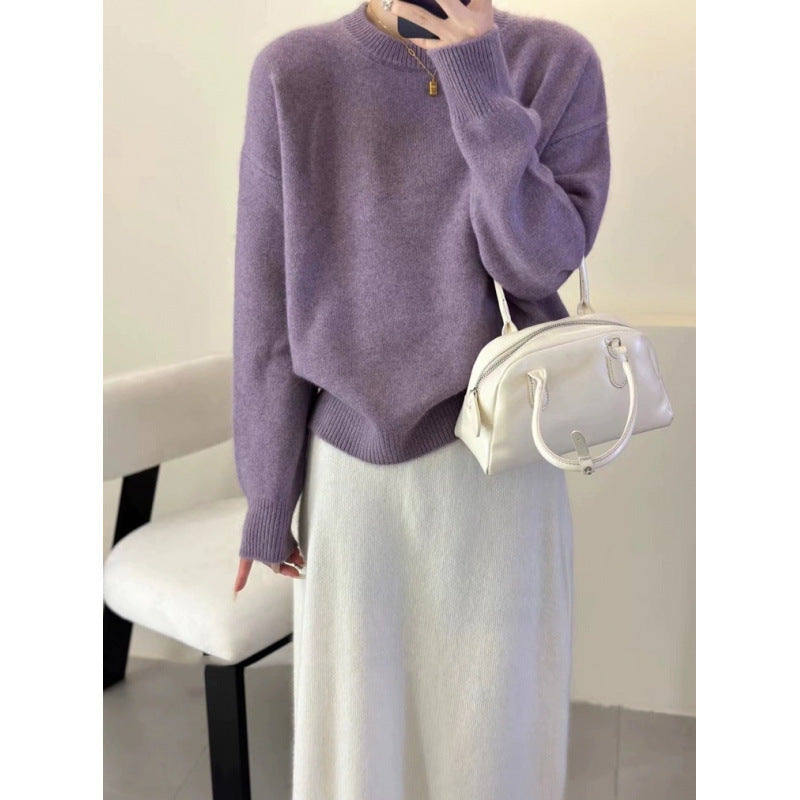 Women's knitted pullover sweater showing hip-length hem detail
