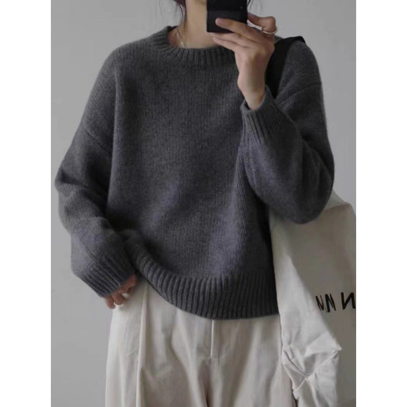 Women's fuzzy pullover sweater showing round neck and shoulder detail