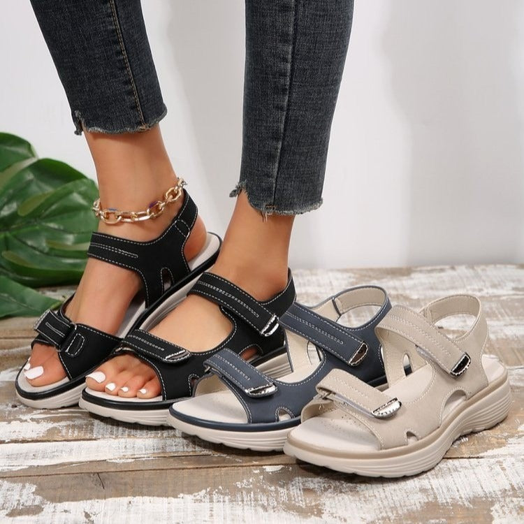 Multi-strap open-toe women's sandals with Velcro adjustable closures and flat heel