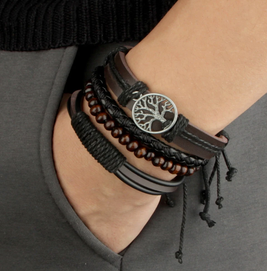 Men's layered bracelet set showing braided cords, beads and metallic Tree of Life charm