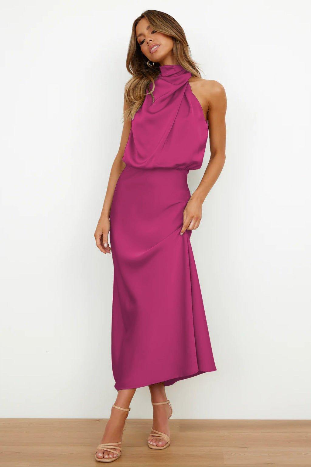 Sleeveless women's satin dress with a halterneck neckline and softly flowing midi-length cut