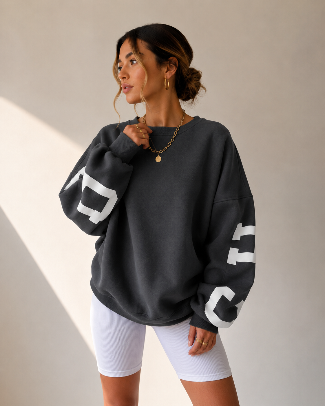 Women's dark gray oversized varsity sweater front view