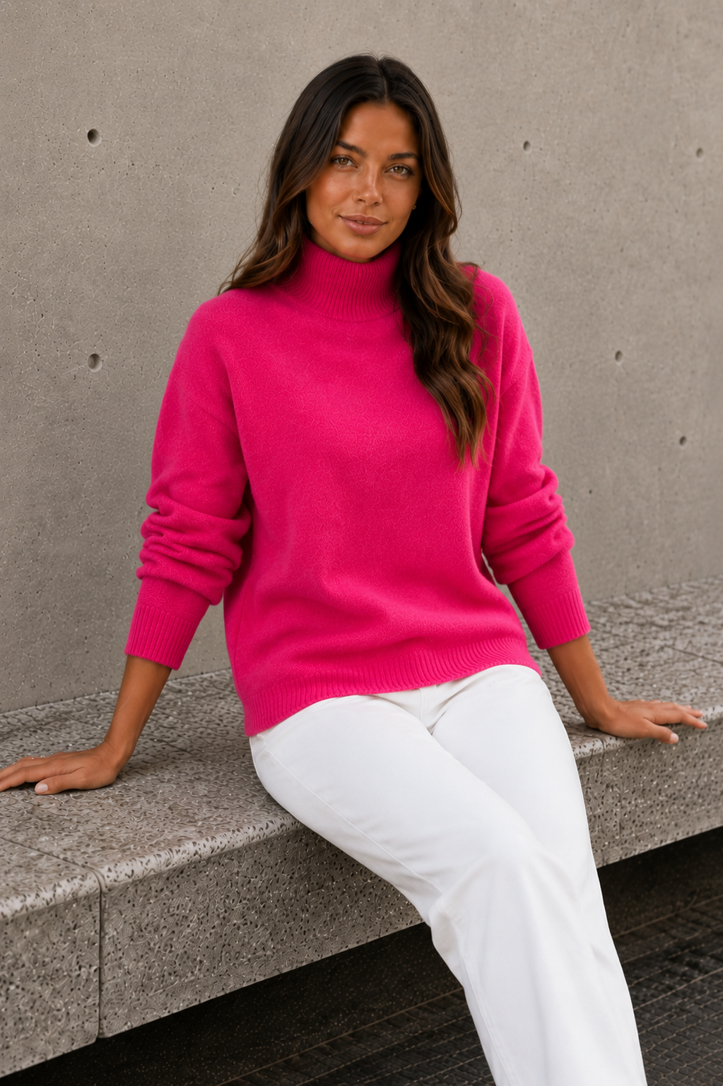 Women's knitted sweater with high neckline, relaxed fit, and ribbed details
