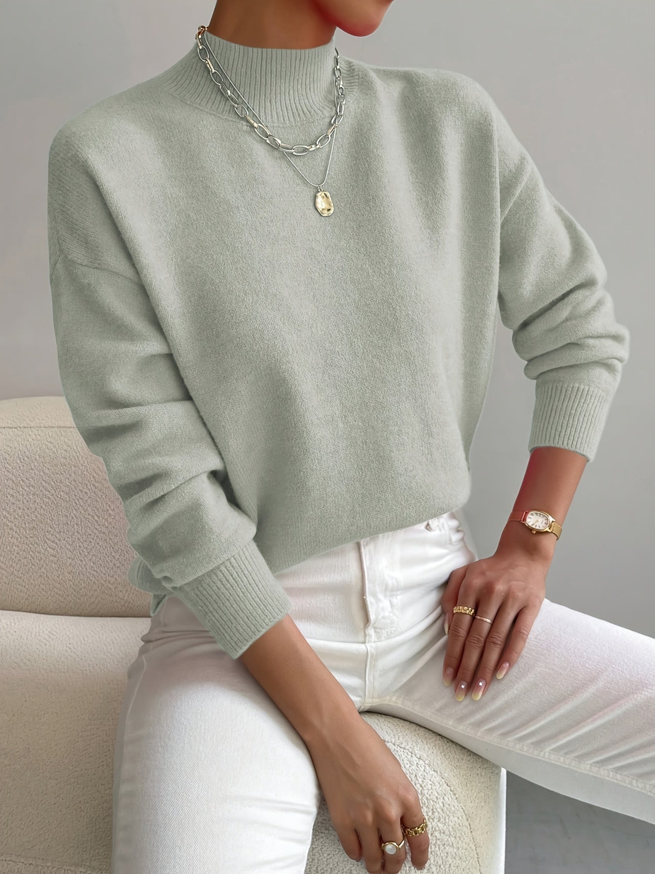 Women's knitted high neck sweater in cotton blend with regular length and ribbed finish