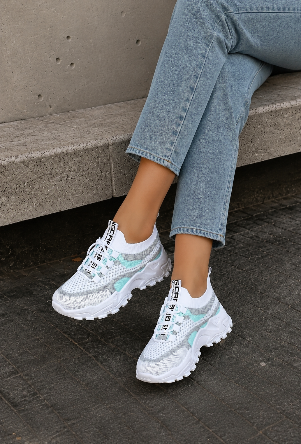 Women's breathable sneakers with knit mesh upper and lace-up design, top-down view