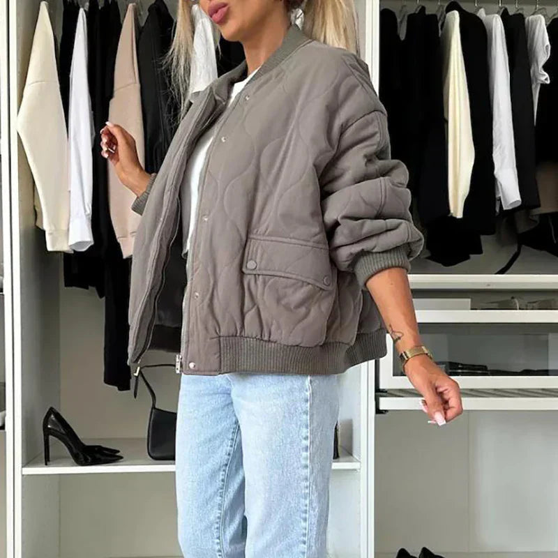 Women's padded jacket with snap buttons, standard length, and ribbed hem
