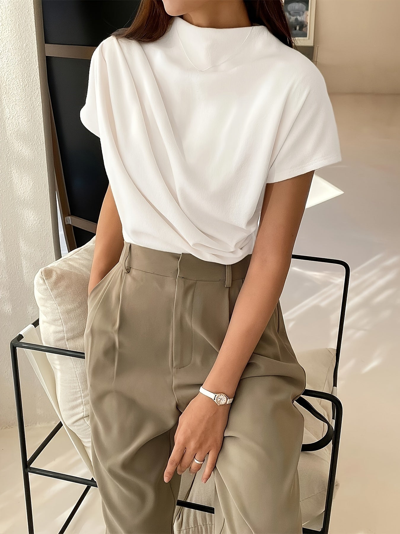 Hip-length draped top with smooth fabric and short sleeves for women
