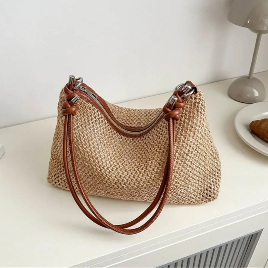Textured woven handbag with leather straps